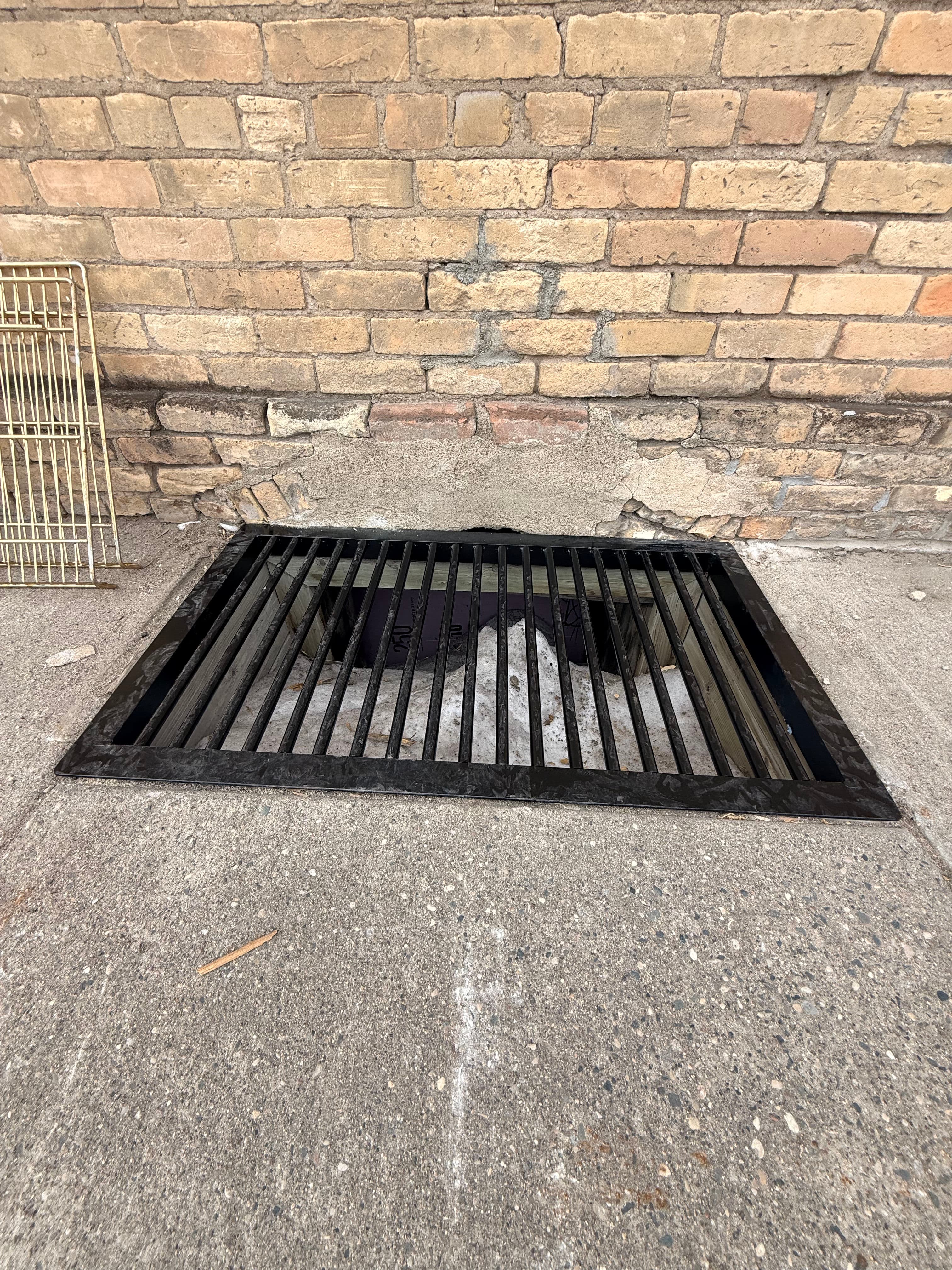 Project Custom Steel Grate for Kindred Grocery Store Installation image